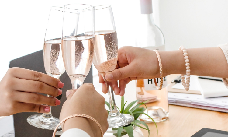 here's to a fresh beginning - three women toasting with glasses of champagne